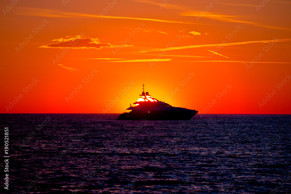 Luxury yacht on open sea at golden sunset Luxury yacht on open sea at golden sunset