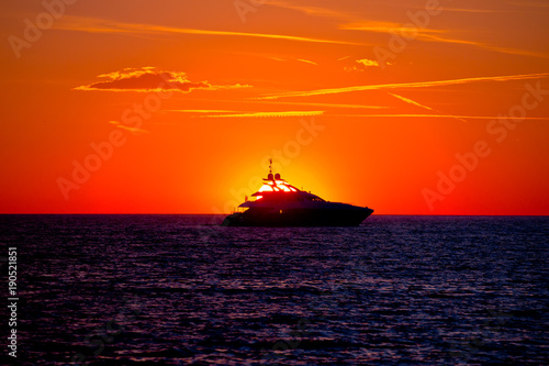 Luxury yacht on open sea at golden sunset © xbrchx