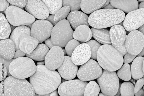 Naklejka Abstrakcjonistyczny naturalny tło z czarny i biały otoczaków kamieniami