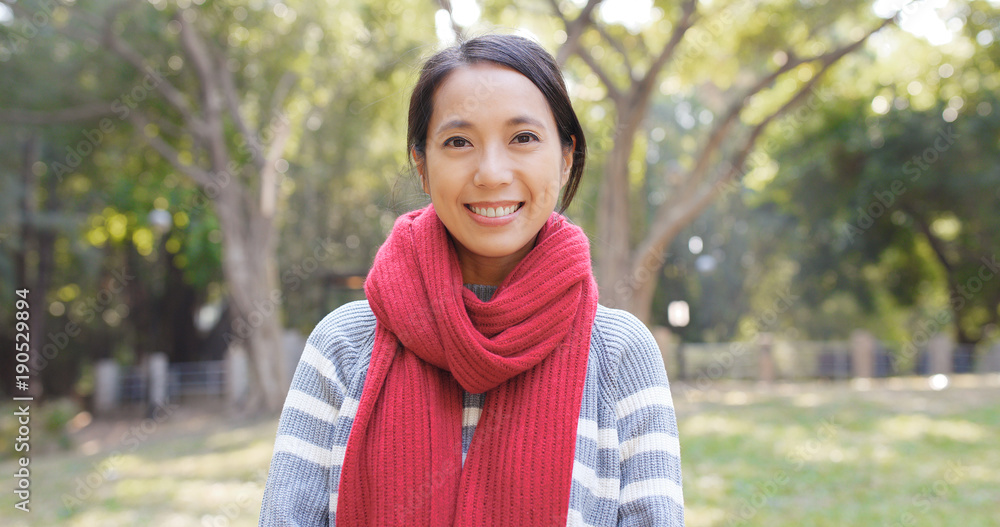 Woman wearing red scarf in the park Woman wearing red scarf in the park