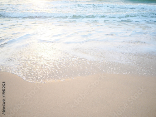 Soft wave of the tropical sea on the sandy beach.