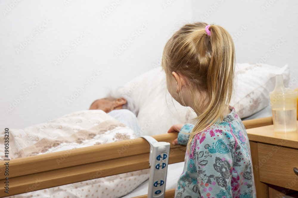 Little girl visiting her dying great granny Little girl visiting her dying great granny