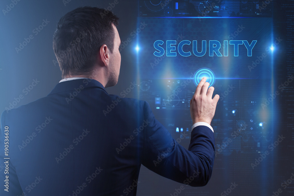 Business, Technology, Internet and network concept. Young businessman working on a virtual screen of the future and sees the inscription: Security Business, Technology, Internet and network concept. Young businessman working on a virtual screen of the future and sees the inscription: Security