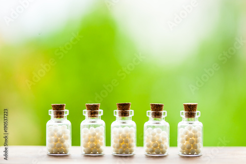 Homeopathy pills in vintage bottles