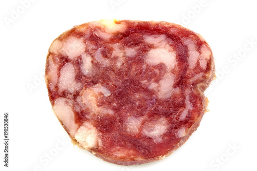 Top view macro detail of smoked salami slices, pepperoni slice, Italian prosciutto crudo ,raw ham texture isolated on white background , with clipping path.