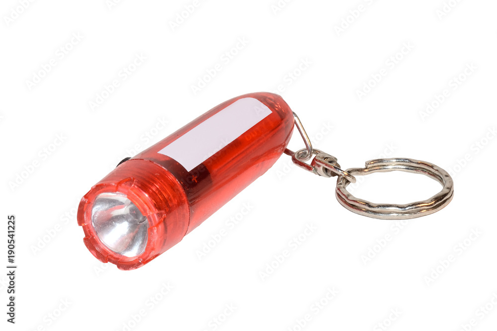 Plastic red flashlight keychain isolated on white background Plastic red flashlight keychain isolated on white background