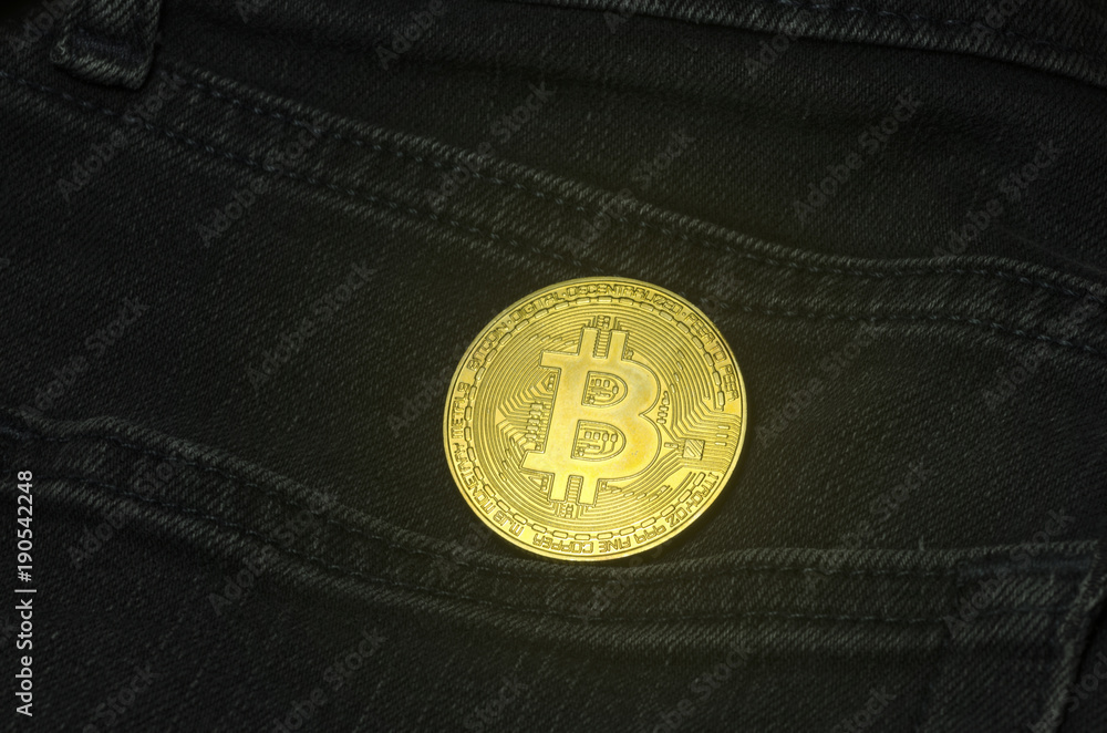 Bit coin in the pocket of black jeans Bit coin in the pocket of black jeans