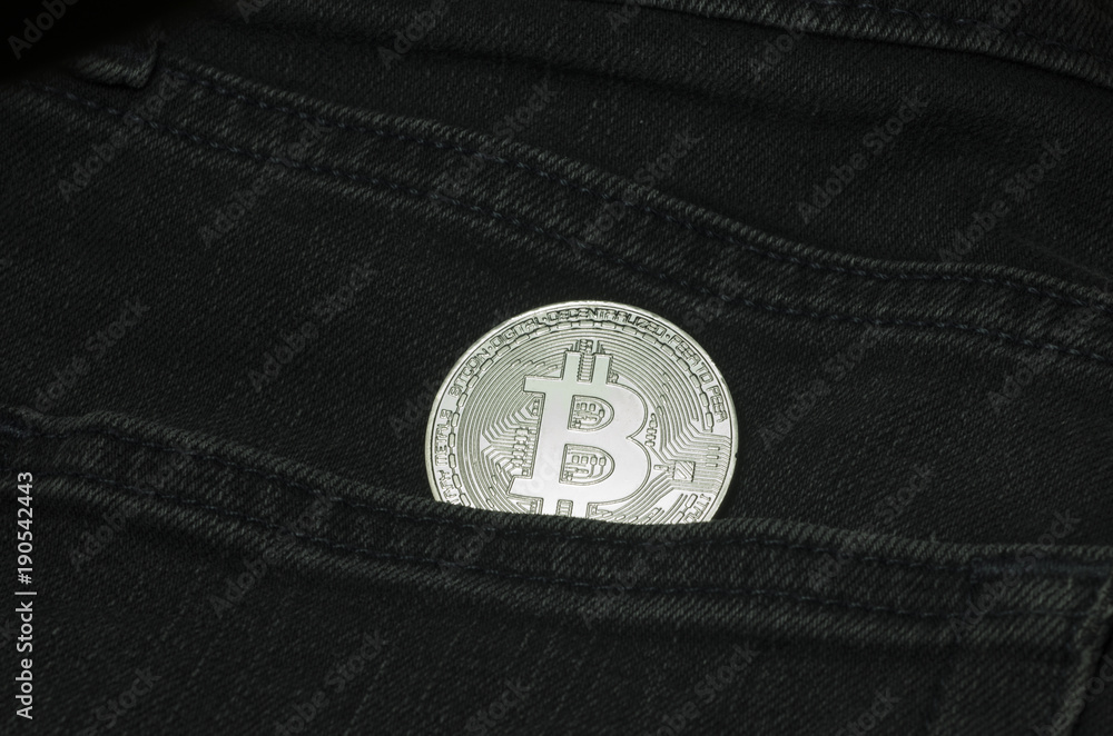 Bit coin in the pocket of black jeans Bit coin in the pocket of black jeans