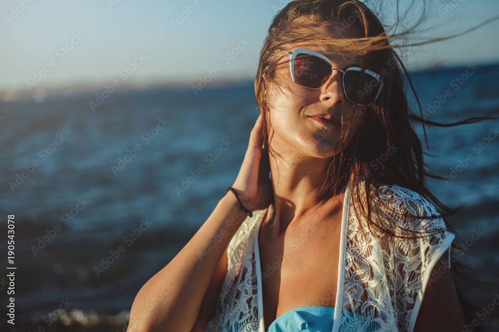 Girl enjoying a breeze on the beach Girl enjoying a breeze on the beach
