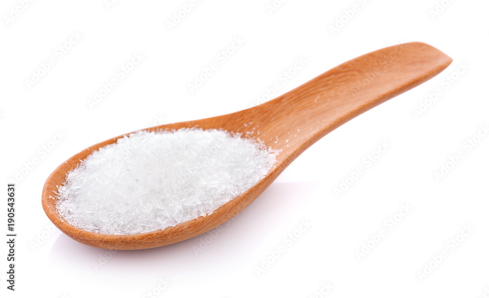 MonosodiumGlutamate (MSG or E621) in spoon on white MonosodiumGlutamate (MSG or E621) in spoon on white