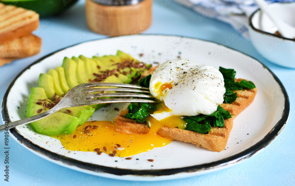 Quick breakfast - poached egg with toast, spinach and avocado.