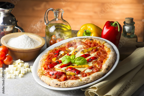 Pizza with peppers on the table