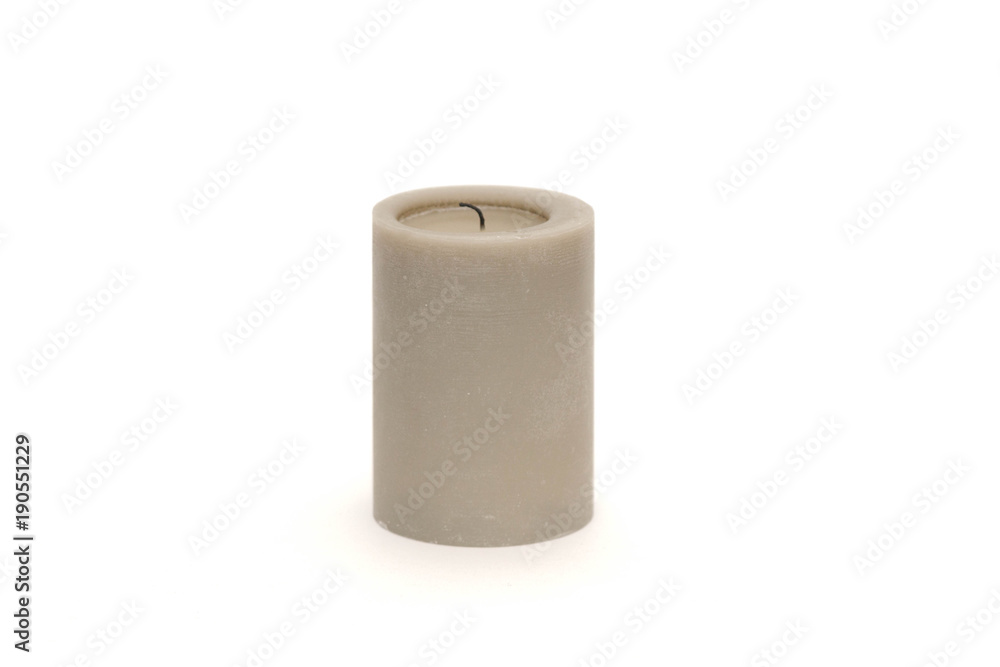 Single gray candle against a white background Single gray candle against a white background