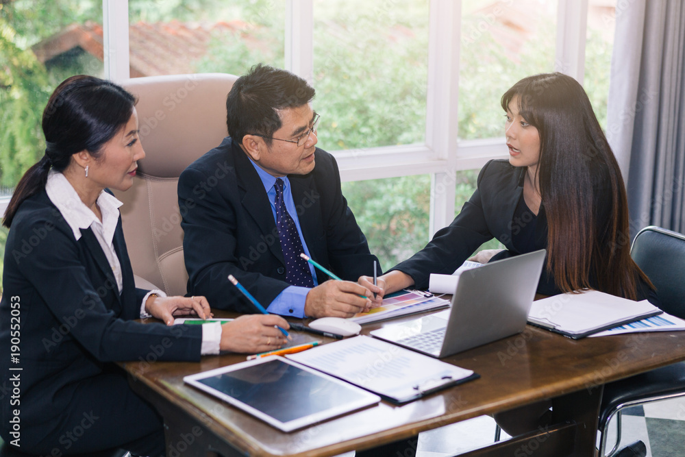 Indoor business meeting, young woman advice information to her team Indoor business meeting, young woman advice information to her team