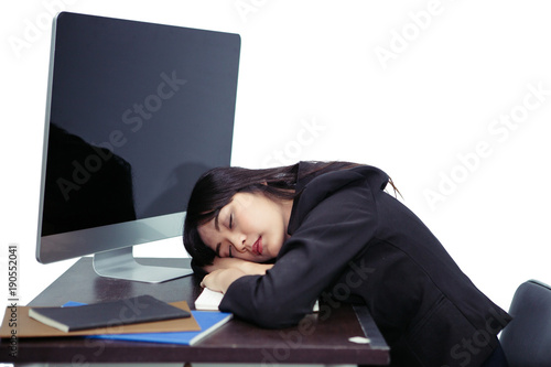 Photos Asian office girl sleeping on desk because of working very hard, isolated with c