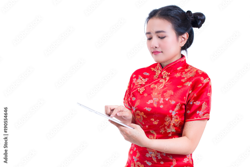 Side view portrait of Beautiful Young asian woman wear chinese dress  traditional cheongsam or qipao using modern digital tablet, Concept buying  digital online, technology, isolated on white background foto de Stock