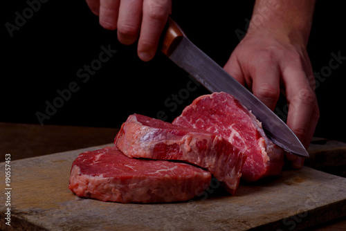 Butcher cuts beef