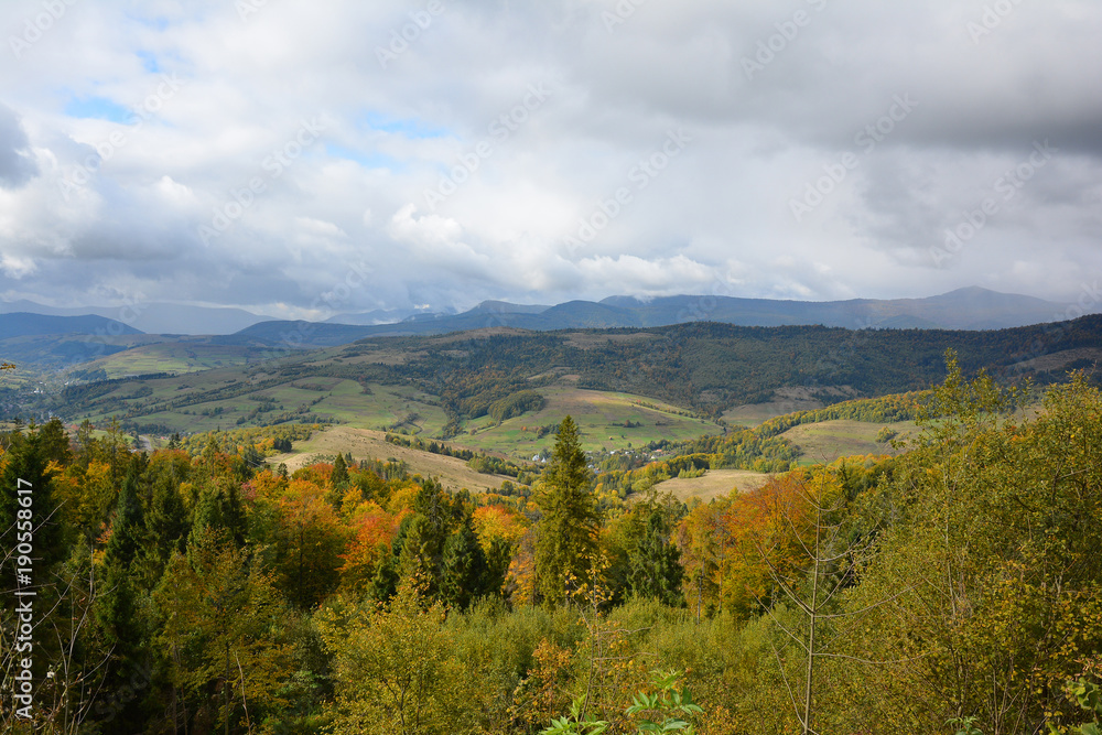 View of mountains and valley from Veretskyi Pass in autumn day before rain.