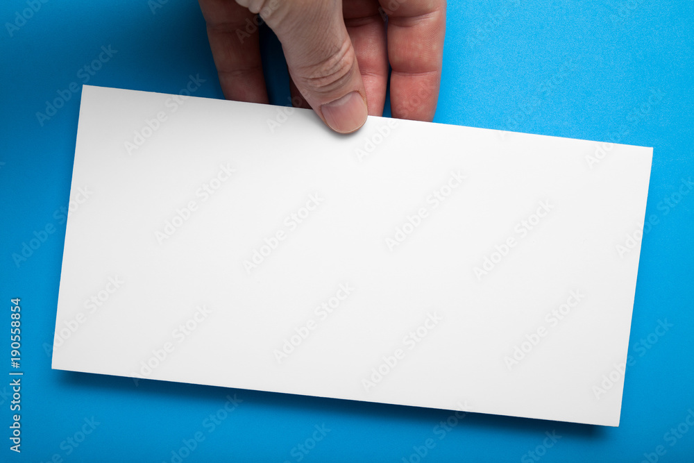 White empty DL Flyer Mock-Up on a blue background. White empty DL Flyer Mock-Up on a blue background.