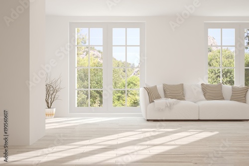 Fototapeta Naklejka Na Ścianę i Meble -  Idea of white room with sofa and summer landscape in window. Scandinavian interior design. 3D illustration