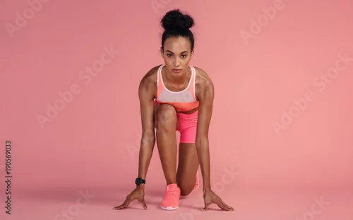 Obraz Sportsmenka ma zamiar rozpocząć bieg