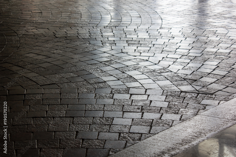 Cobbled stone way. Nice pavement stone pattern background.