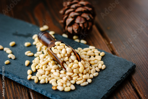 wooden scoop with pine nuts...