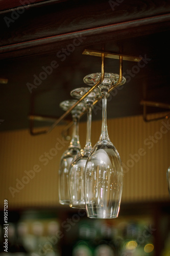 Wine glasses in a bar on wo...