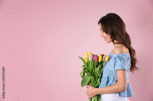 Beautiful woman holding bou...