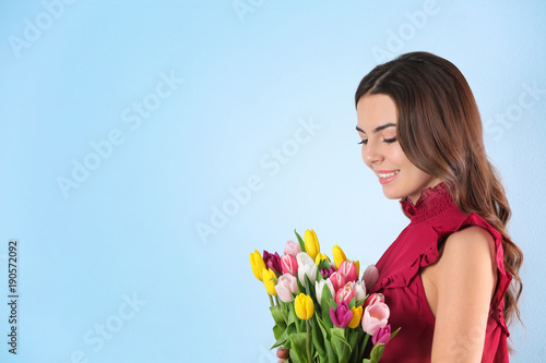 Beautiful woman holding bou...