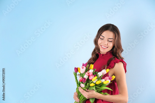 Beautiful woman holding bou...