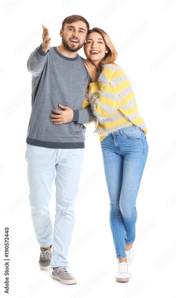 Young couple in casual clothes walking on white background Young couple in casual clothes walking on white background