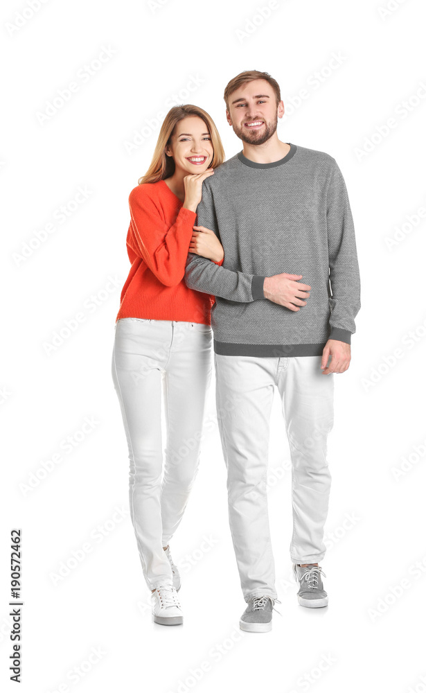 Young couple in casual clothes walking on white background Young couple in casual clothes walking on white background