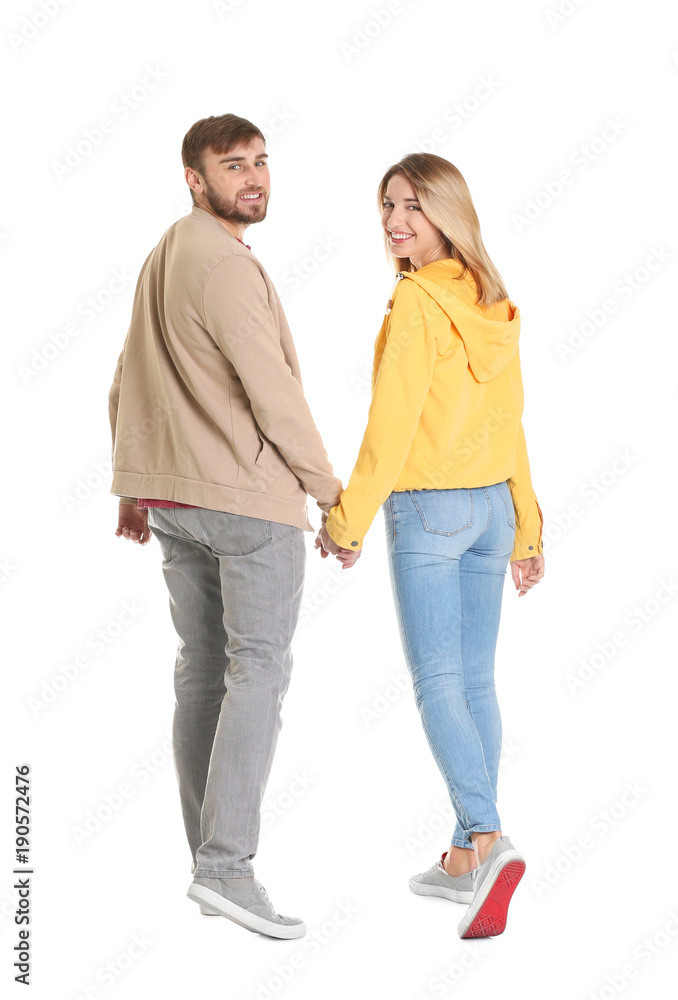 Young couple in casual clothes walking on white background Young couple in casual clothes walking on white background