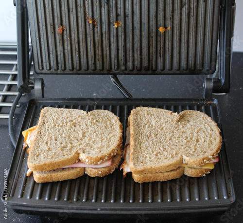 Baking two ham and cheese sandwiches