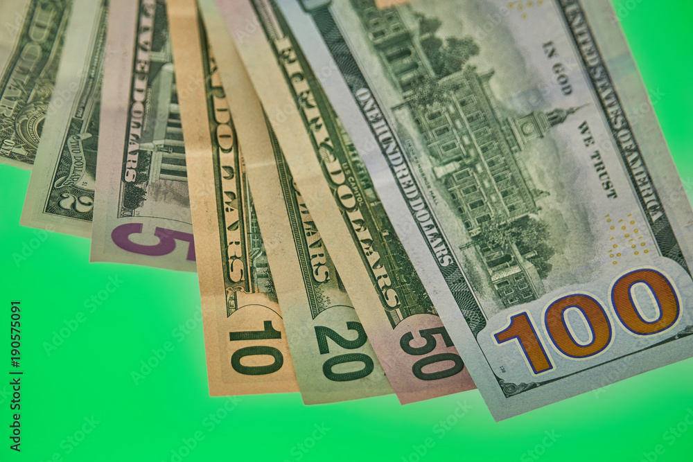 Dollars on green background