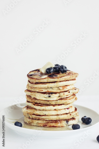 blueberry pancakes on white background