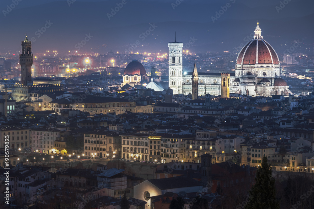 Cathedral of Florence rising above the city in the night