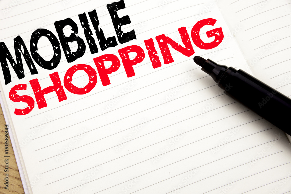 Mobile Shopping. Business concept for Cellphone online order written on notebook with copy space on book background with marker pen Mobile Shopping. Business concept for Cellphone online order written on notebook with copy space on book background with marker pen