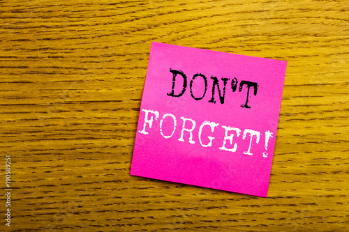 Handwriting Announcement text showing Do Not Forget. Business concept for Reminder Message written on sticky note empty paper, wooden background with copy space, sunglasses.