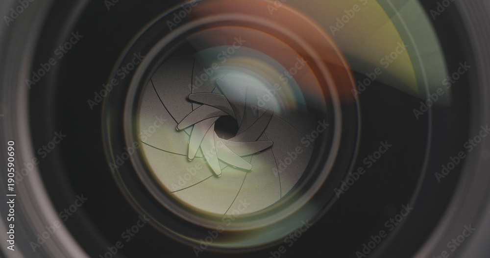 Camera lens adjusting aperture and zoom in and out Camera lens adjusting aperture and zoom in and out