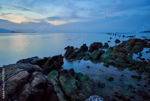 Sea lagoon with rocks at sunset time