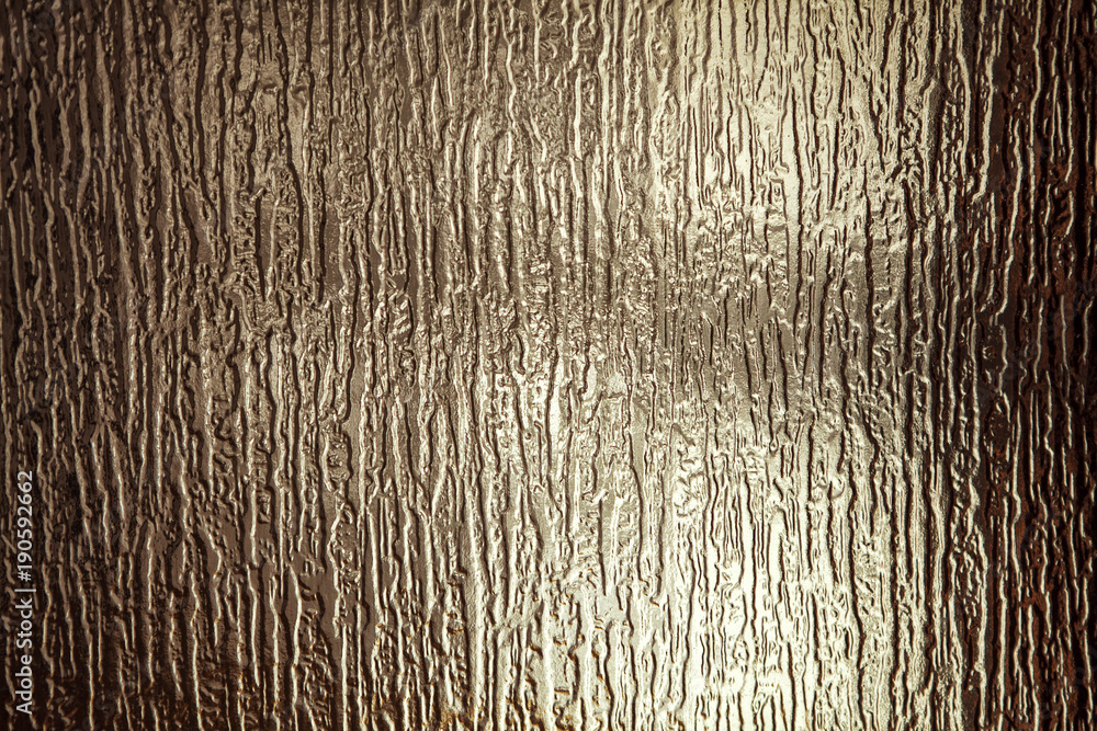 sunlight on the surface of corrugated glass
