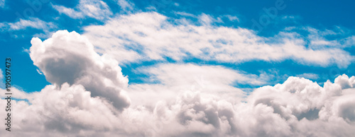 Panorama banner blue sky white puffy clouds for web design photo