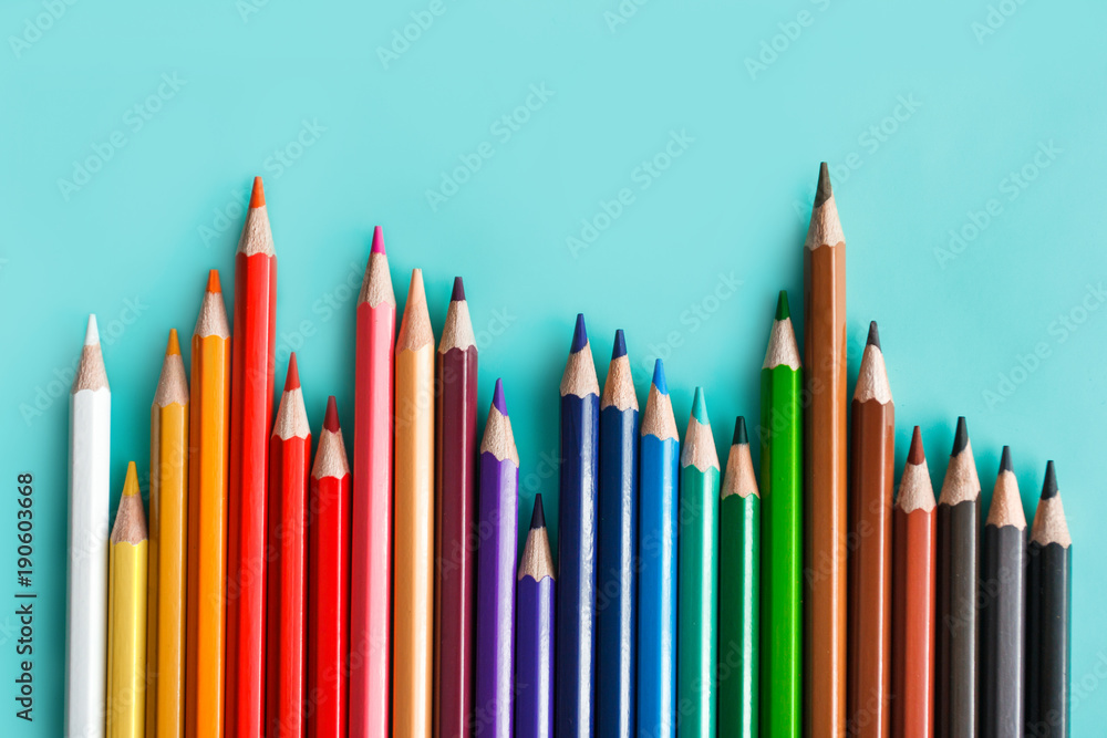 colorful pencils on pastel background colorful pencils on pastel background