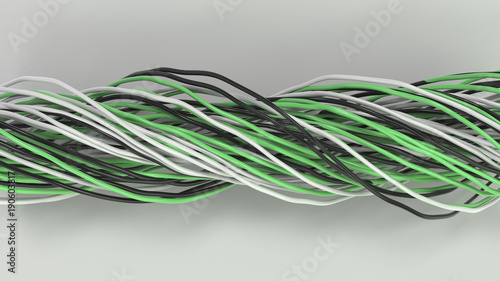 Twisted black, white and green cables and wires on white surface