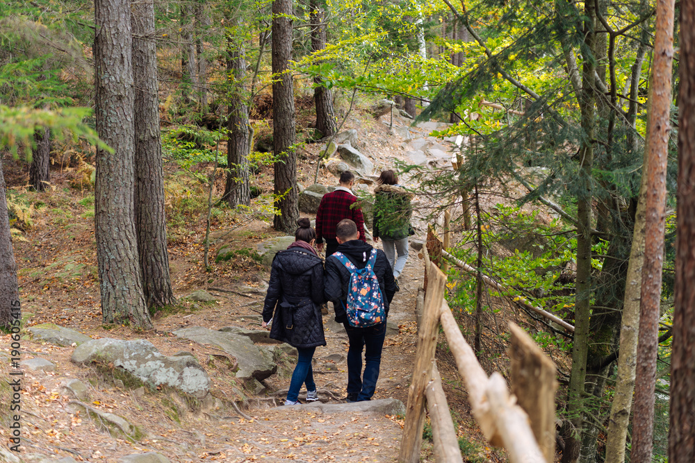 man and woman walking along hiking trail man and woman walking along hiking trail