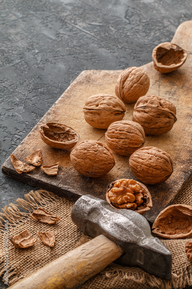Walnuts on dark stone background. Healthy food concept Walnuts on dark stone background. Healthy food concept