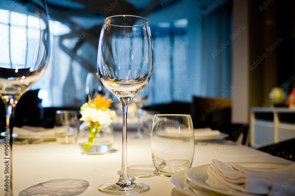 Empty glasses wine in restaurant. Glass water.dish spoon fork on table at restaurant Empty glasses wine in restaurant. Glass water.dish spoon fork on table at restaurant