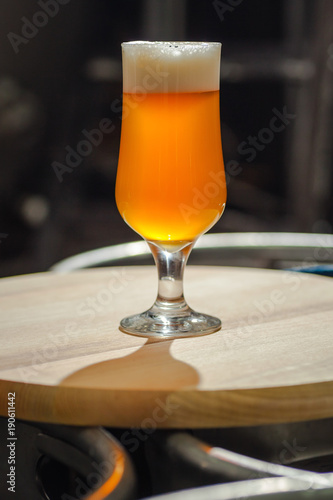 Light beer on wooden tray